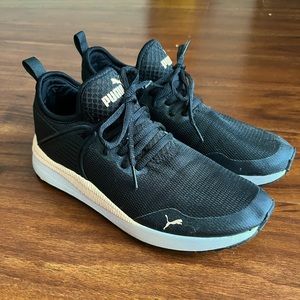 Women’s size 8.5 Pumas. Black with very light pink details. Like new!